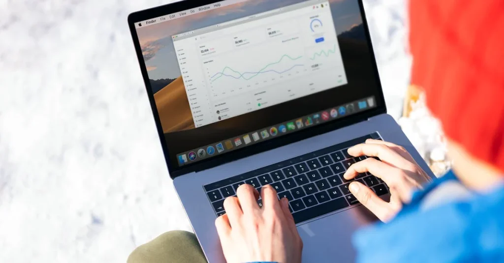 Person typing on laptop displaying analytics dashboard comparing Thoughtspot vs Looker business intelligence tools.